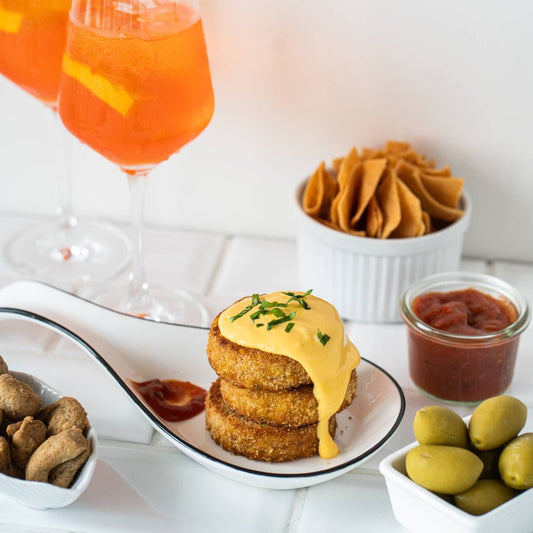 Aperitif with mini burger of lentils and delicious snacks